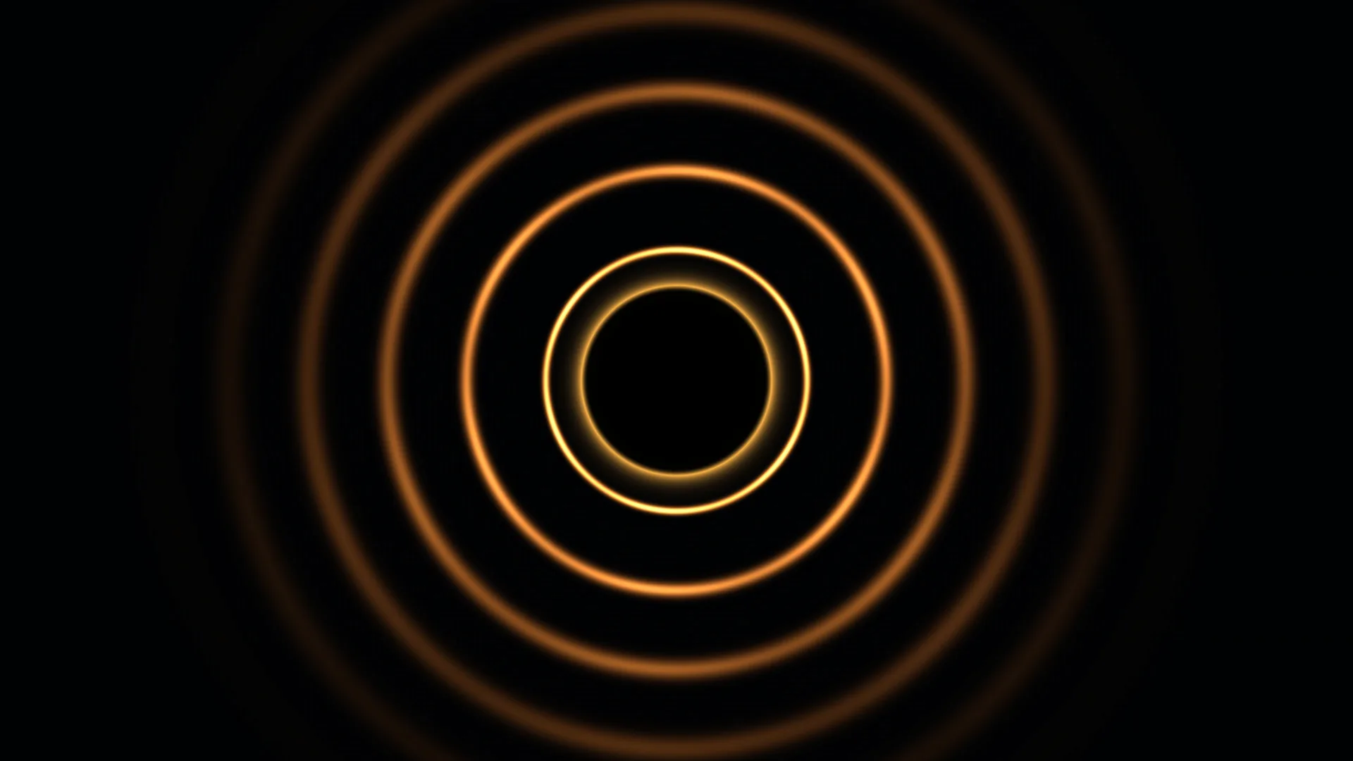 Concentric amber rings on a black field — free 3840x2160 4K wallpaper image